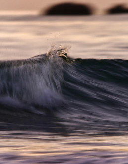 Breaking wave after sunset
